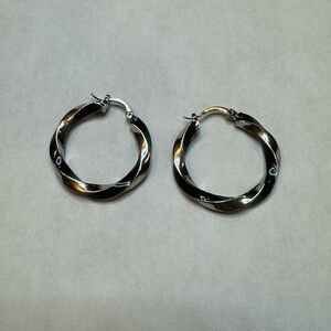 Lia Sophia “Twist and Shout” black and silver twist hoop earrings, pierced.